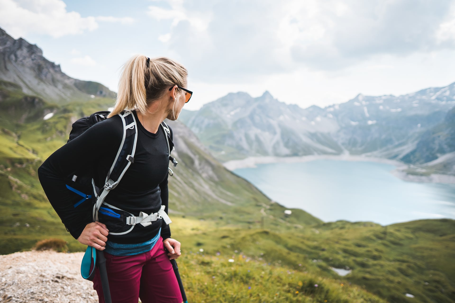 Hiker overlooking a mountain lake